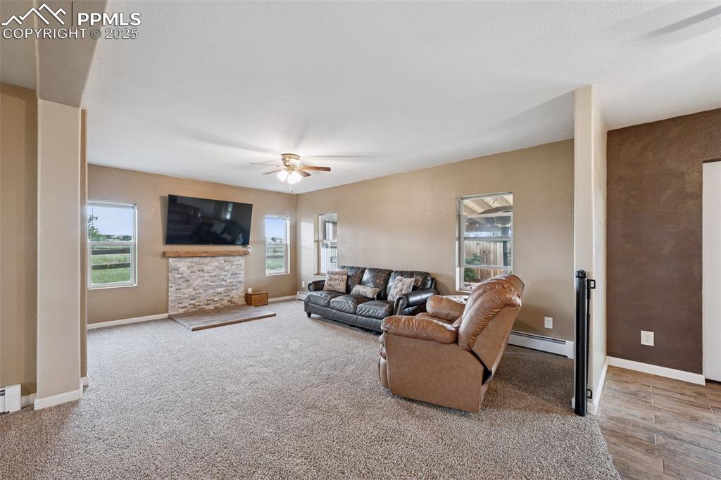 13490 Halleluiah Trail Elbert, CO 80106 - Photo 8 of 38 a living room with furniture and a flat screen tv