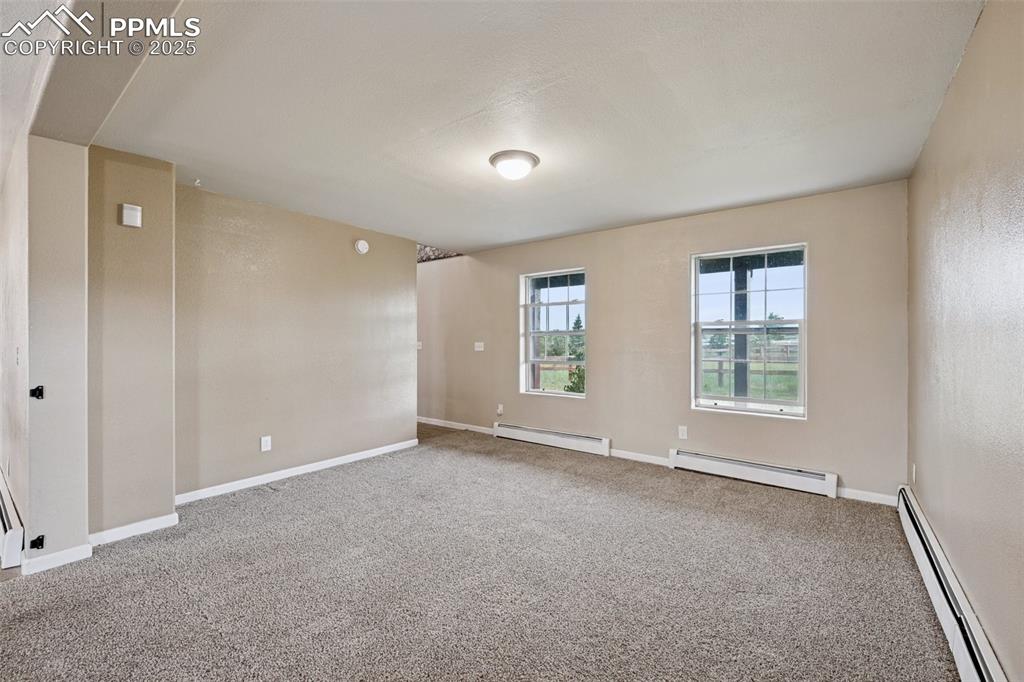 13490 Halleluiah Trail Elbert, CO 80106 - Photo 10 of 38 a view of an empty room with windows