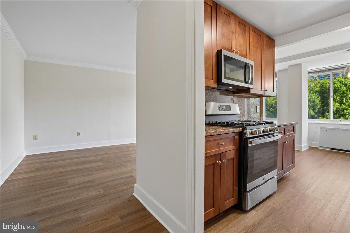 4000 Tunlaw Road Northwest, Unit 1003 Washington, DC 20007 - Photo 6 of 25 Modern kitchen meets open living space.