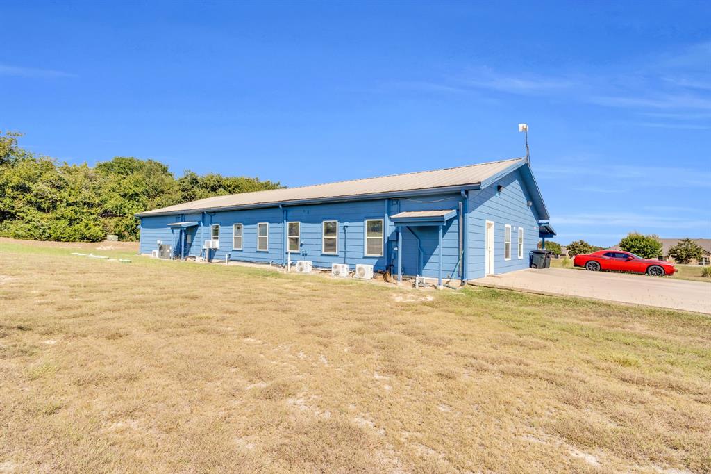 3841 Ledgestone Lane Midlothian, TX 76065 - Photo 13 of 21 Ranch-style home featuring a front lawn and a metal roof