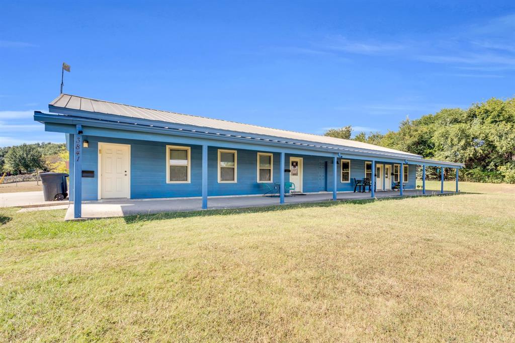 3841 Ledgestone Lane Midlothian, TX 76065 - Photo 2 of 21 View of front of house with a front lawn, a metal roof, and covered porch