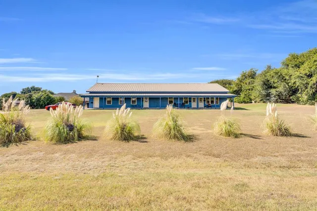 a view of house with a swimming pool