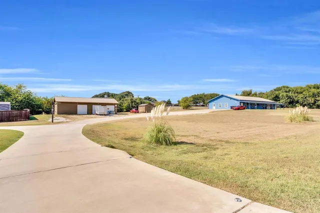 a view of a porch with furniture and a patio