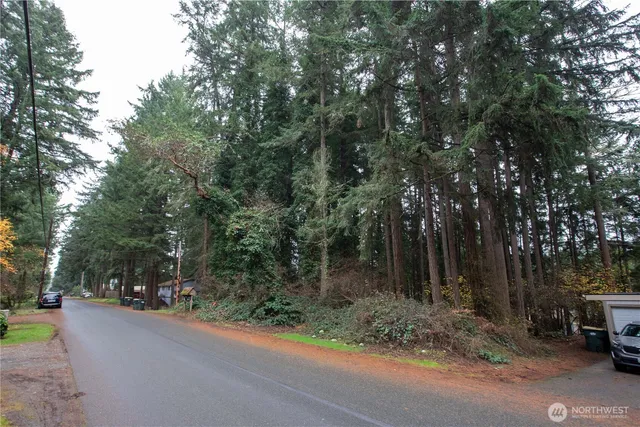 a view of street with parked cars