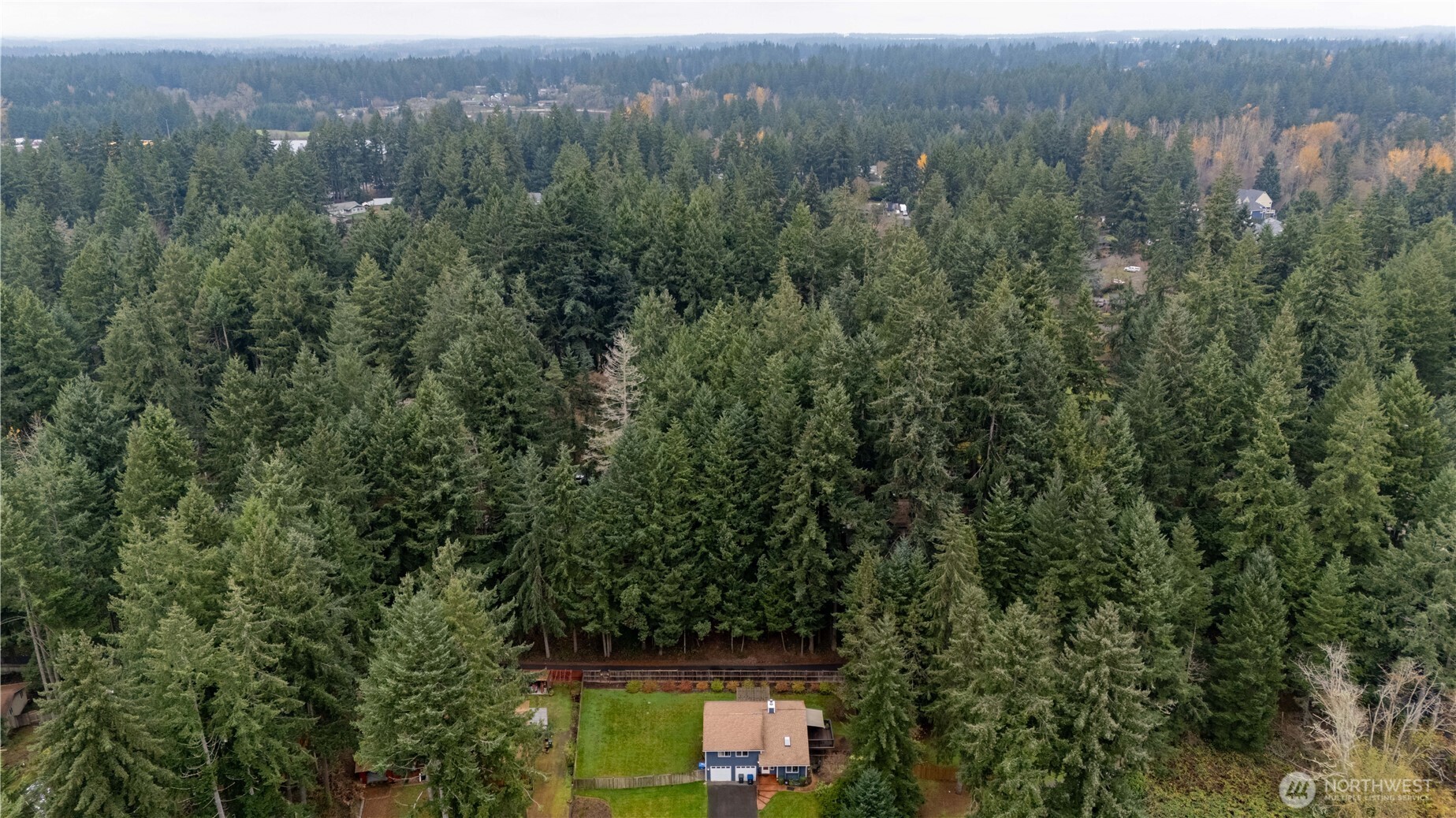 6943 20th Avenue Southeast Lacey, WA 98503 - Photo 19 of 26 an aerial view of residential house with green space