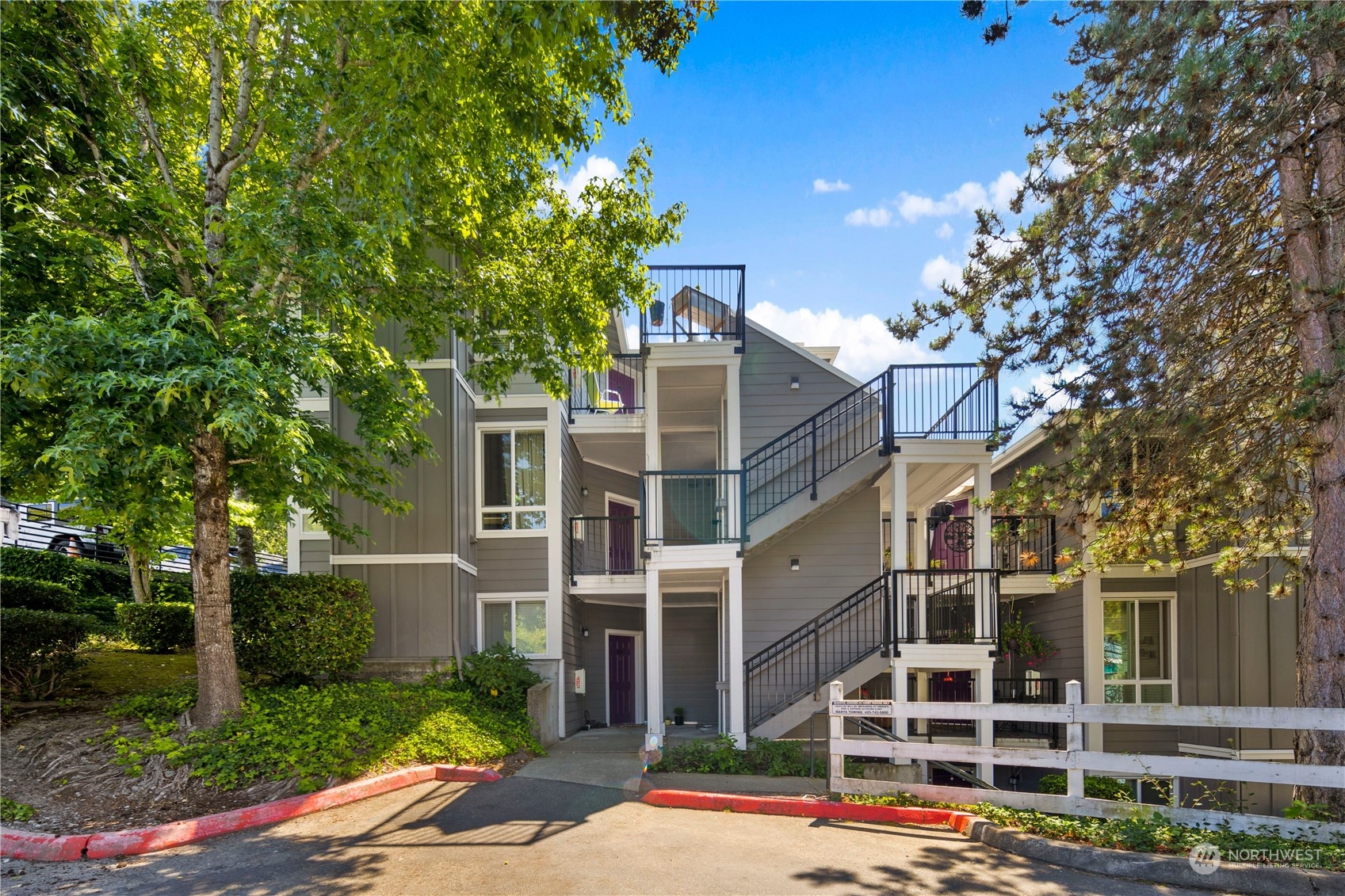 3914 243rd Place Southeast, Unit L401 Bothell, WA 98021 - Photo 1 of 25 front view of a building with a street