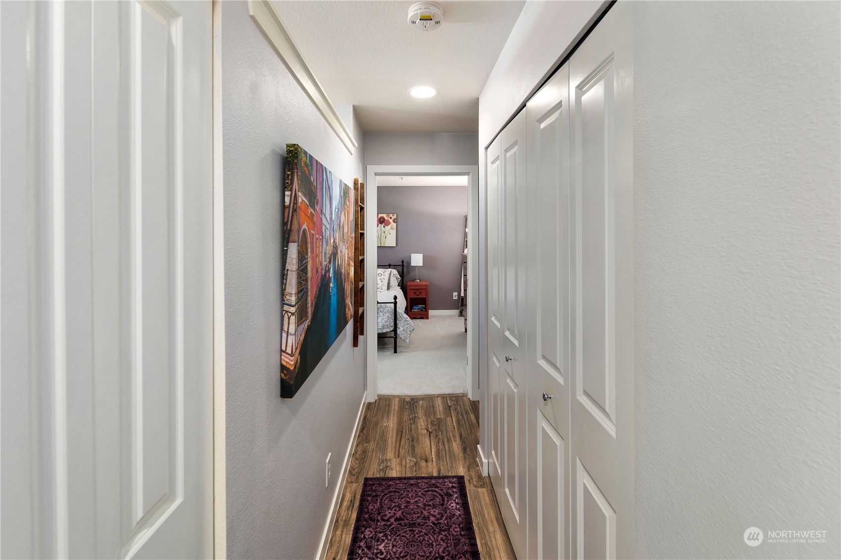 3914 243rd Place Southeast, Unit L401 Bothell, WA 98021 - Photo 13 of 25 a walk in closet with wooden floor
