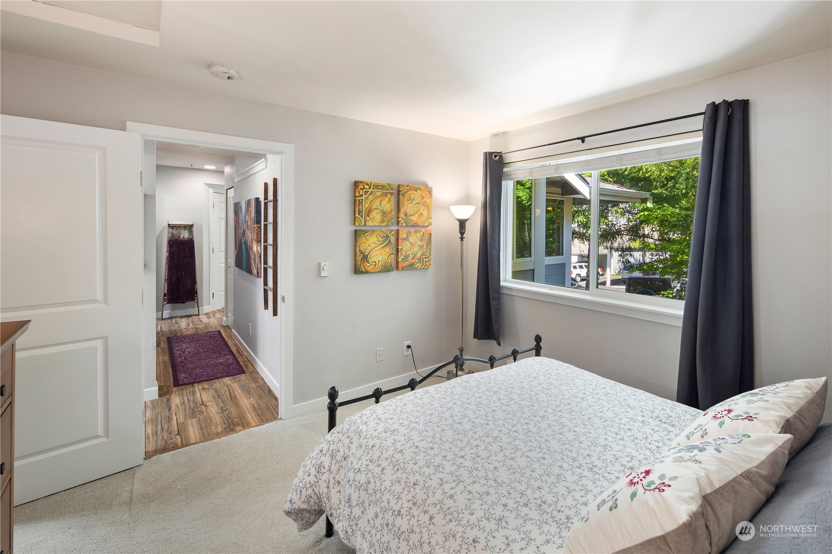 3914 243rd Place Southeast, Unit L401 Bothell, WA 98021 - Photo 14 of 25 a bedroom with a bed and a window