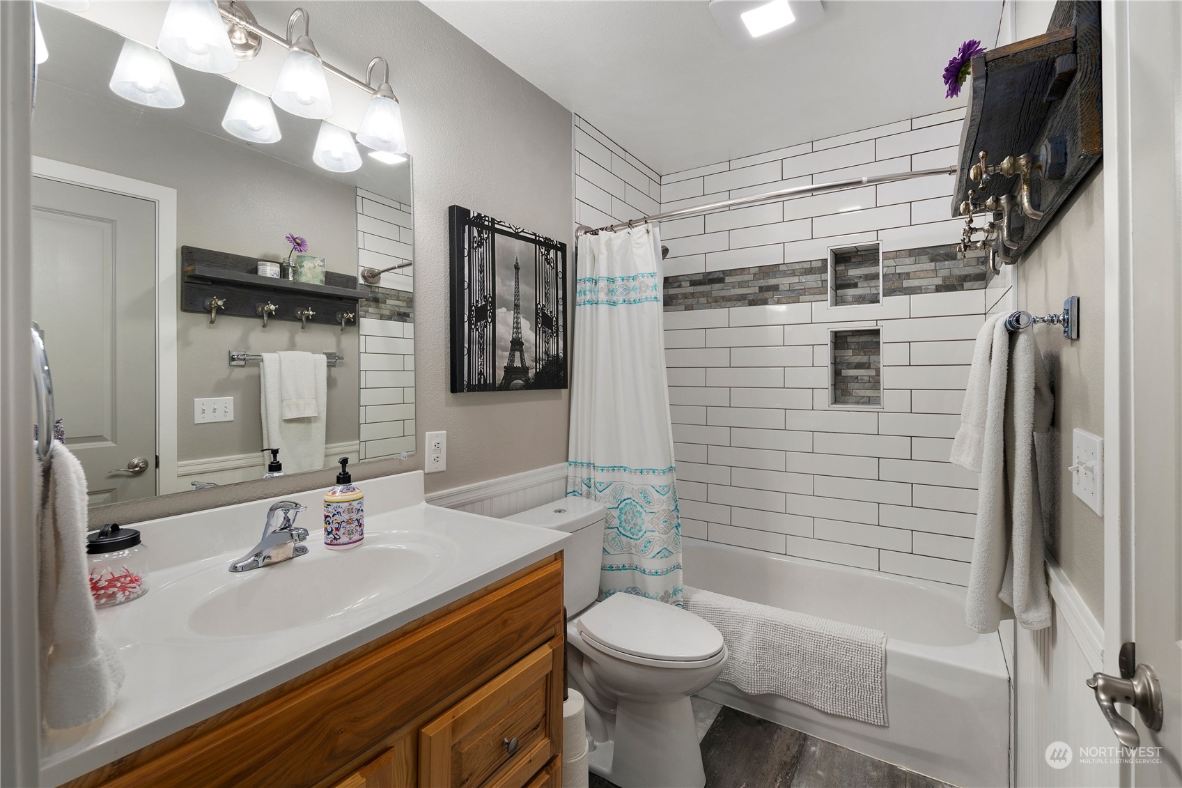 3914 243rd Place Southeast, Unit L401 Bothell, WA 98021 - Photo 15 of 25 a bathroom with a sink a toilet and shower