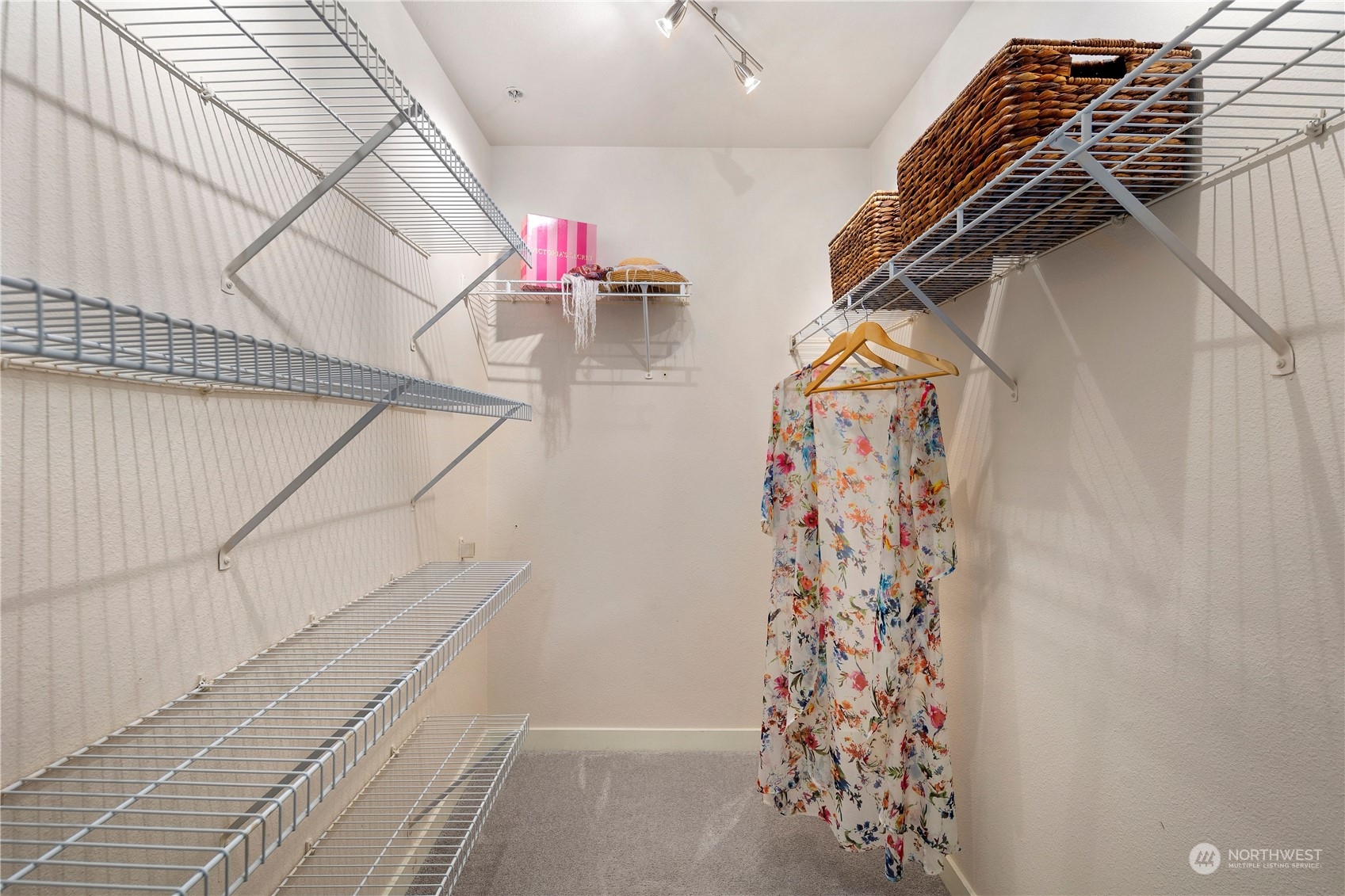3914 243rd Place Southeast, Unit L401 Bothell, WA 98021 - Photo 19 of 25 a view of walk in closet with clothes and shoes