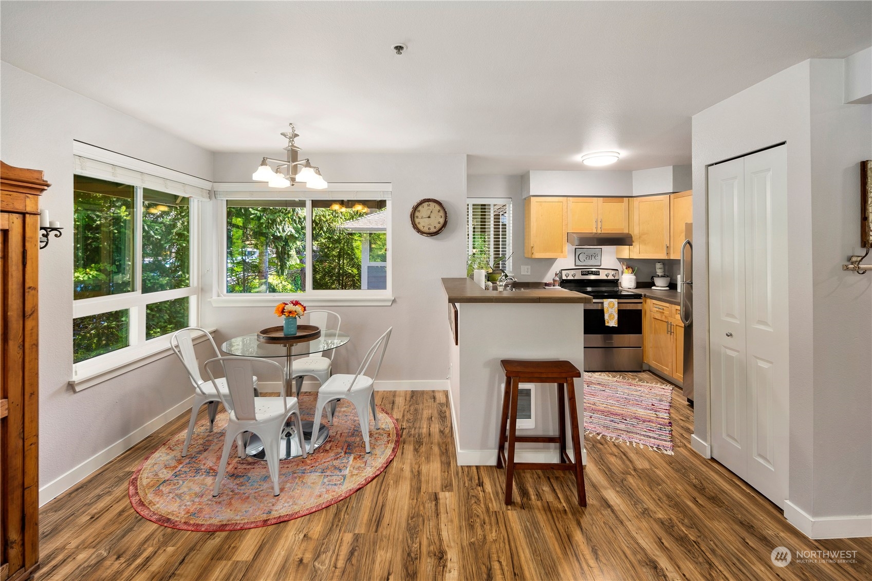 3914 243rd Place Southeast, Unit L401 Bothell, WA 98021 - Photo 5 of 25 a view of a dining room with furniture window and outside view