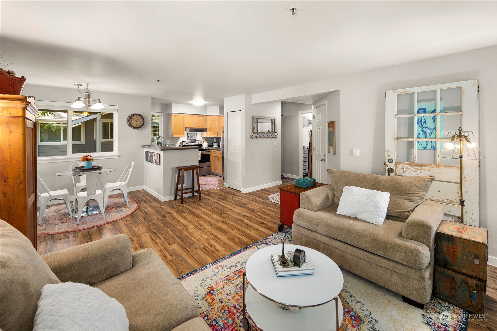 3914 243rd Place Southeast, Unit L401 Bothell, WA 98021 - Photo 7 of 25 a living room with furniture and wooden floor