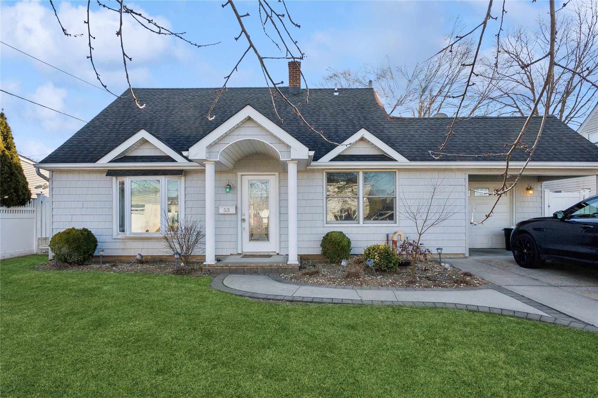 53 Carnation Road Levittown, NY 11756 - Photo 1 of 1 Single story home with a front yard and a garage