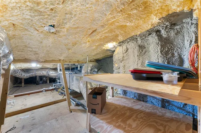 a view of a patio with table and chairs