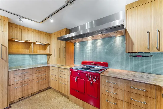 a kitchen with stainless steel appliances granite countertop a sink and cabinets