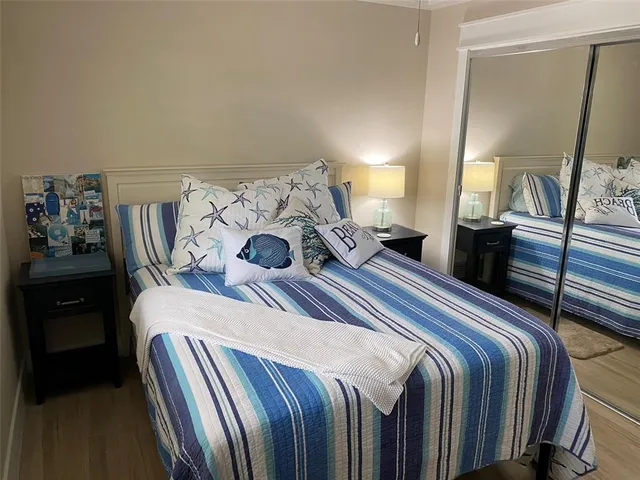 a bedroom with a bed and a television