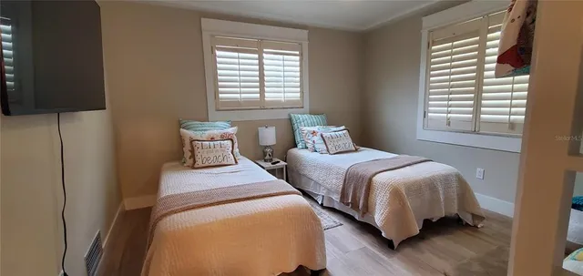 a living room with furniture and a lamp