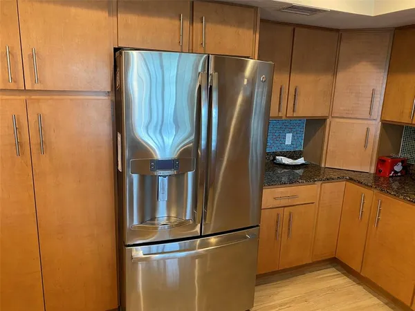 a bathroom with double vanity sink and a mirror