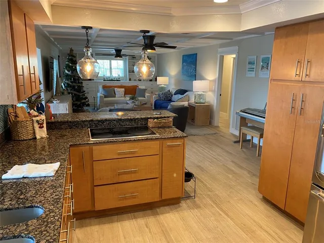 a bathroom with a sink a toilet a mirror and shower