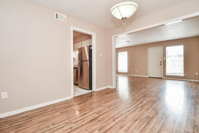 a view of a livingroom with wooden floor