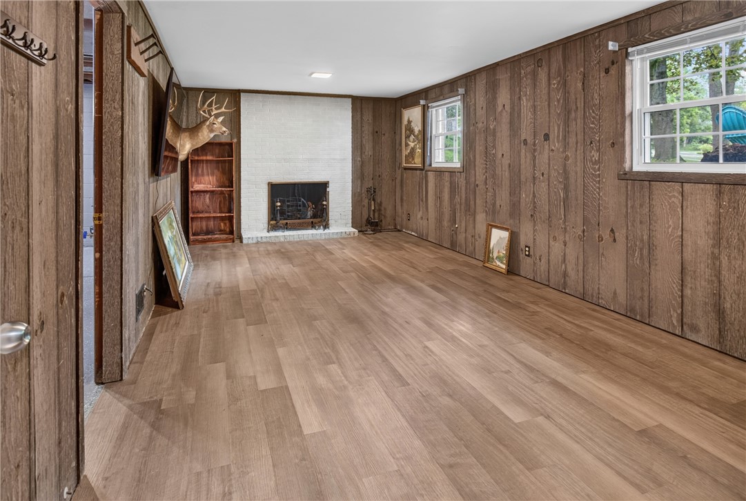 50 Heather Drive Rochester, NY 14625 - Photo 22 of 31 The family room in the lower level features a fireplace and new flooring