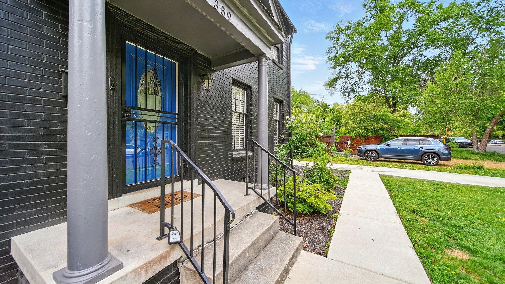359 South Fenwick Road Memphis, TN 38111 - Photo 4 of 31 Property entrance featuring brick siding and a lawn