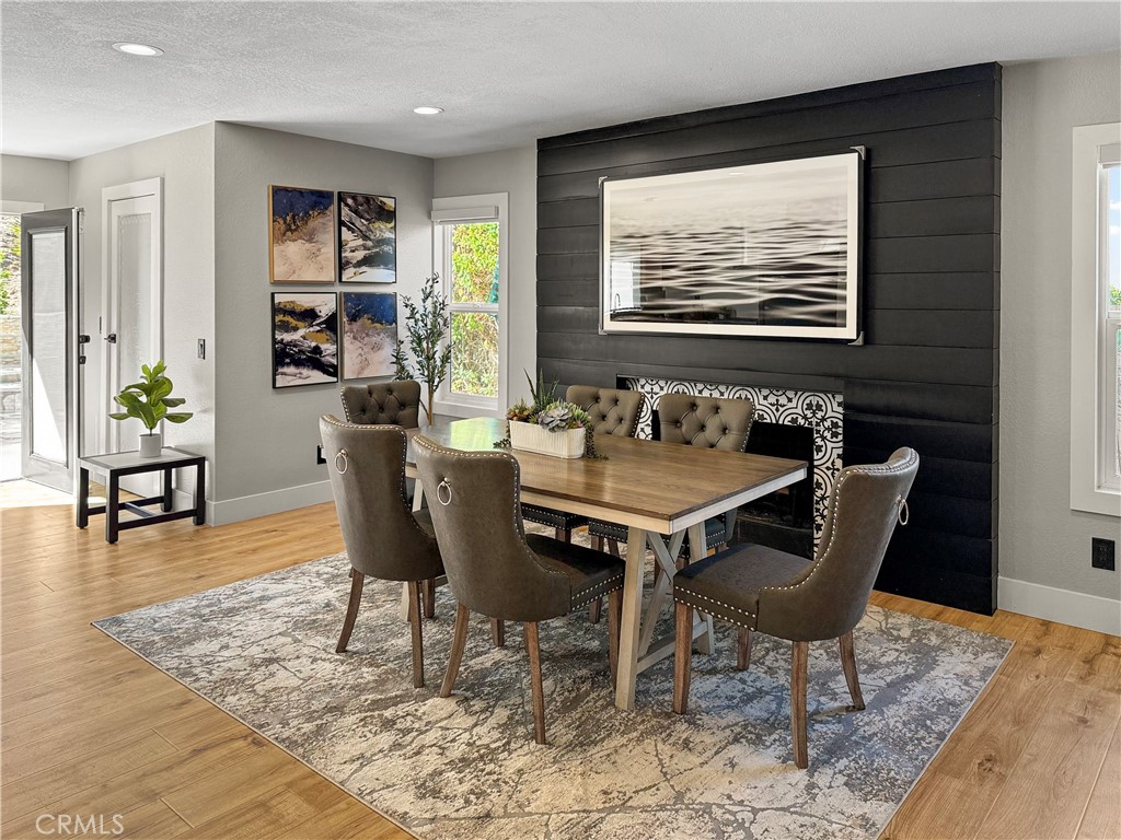 16955 Lake Knoll Parkway Riverside, CA 92503 - Photo 9 of 42 a dining room with furniture a rug and wooden floor