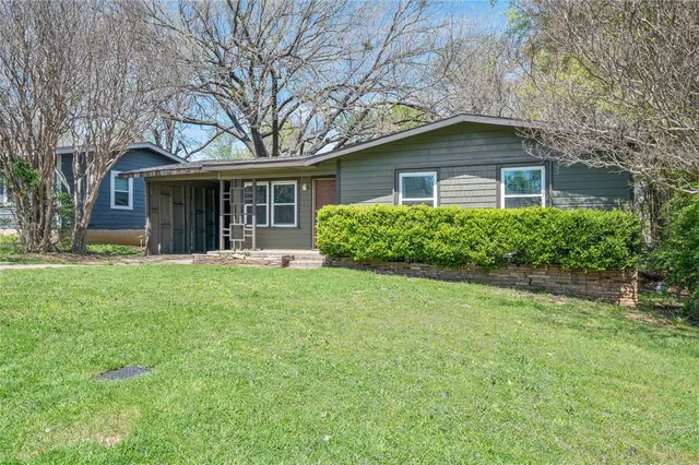 front view of house with a yard