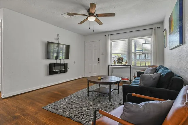 a living room with furniture and a table