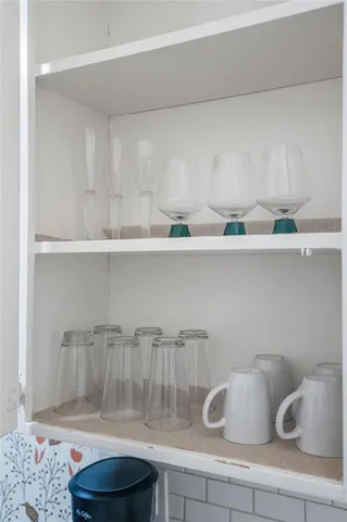 a kitchen with a table and cabinets