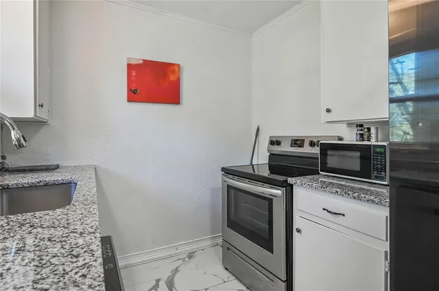 a kitchen with a stove and a microwave
