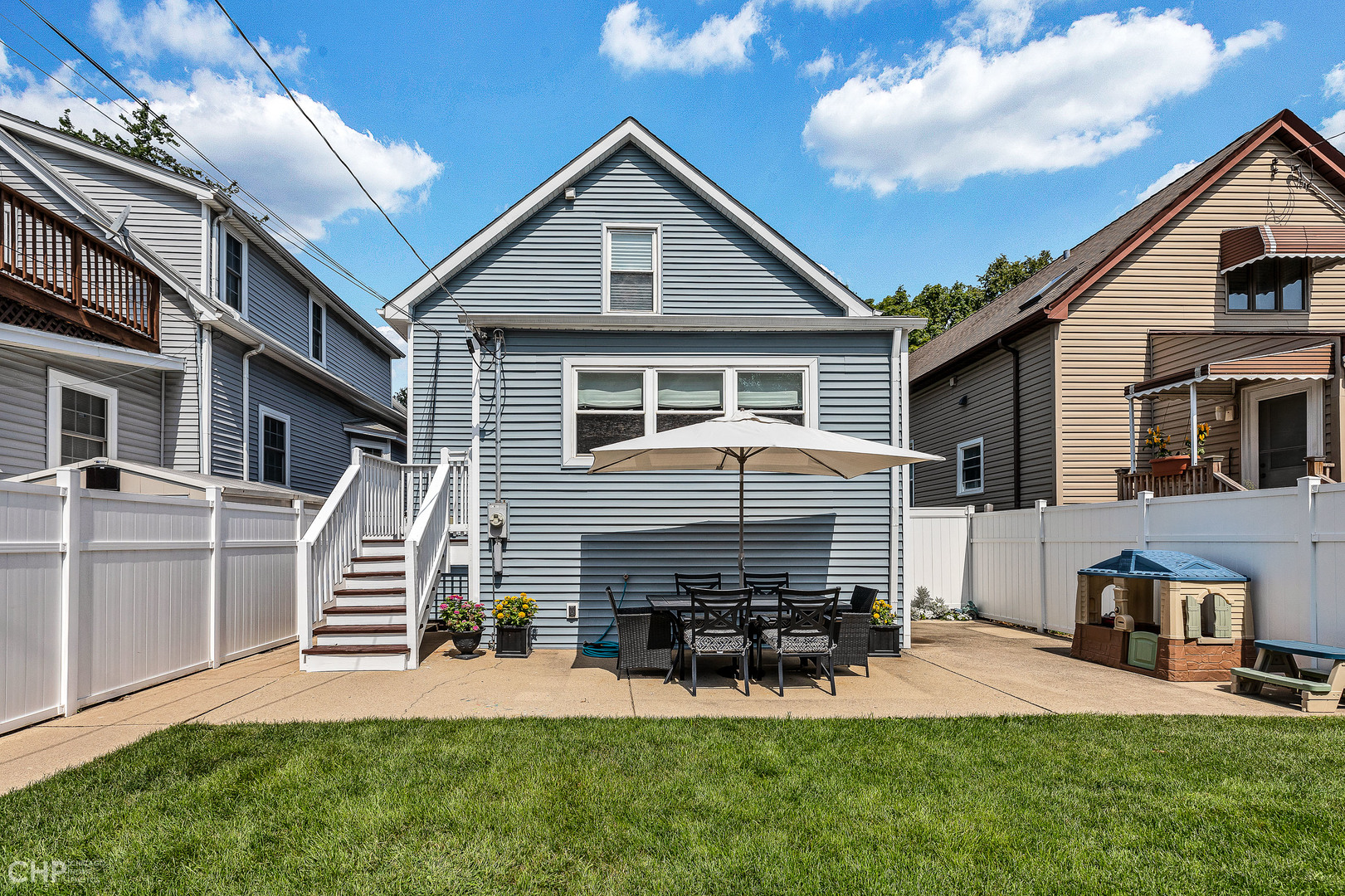 4841 West Berenice Avenue Chicago, IL 60641 - Photo 17 of 34 a view of a house with a yard porch and sitting area