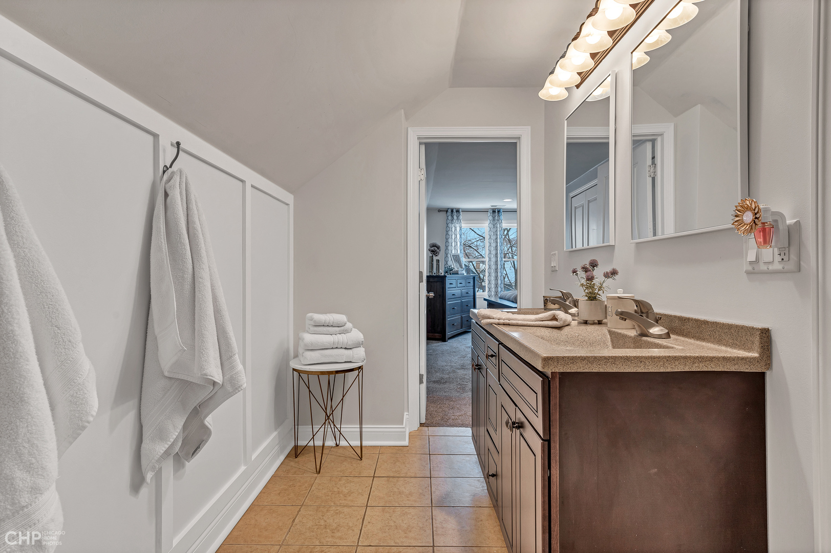 4841 West Berenice Avenue Chicago, IL 60641 - Photo 24 of 34 a bathroom with a sink a toilet and a mirror