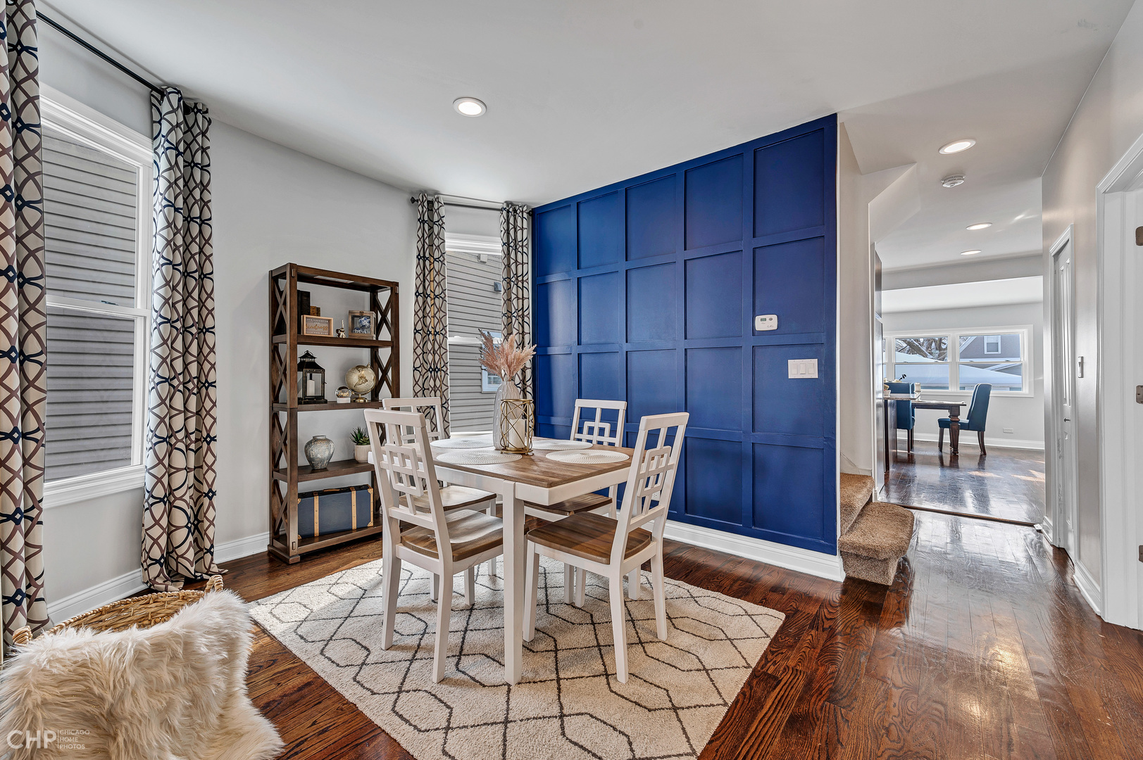 4841 West Berenice Avenue Chicago, IL 60641 - Photo 6 of 34 a view of a dining room with furniture and wooden floor
