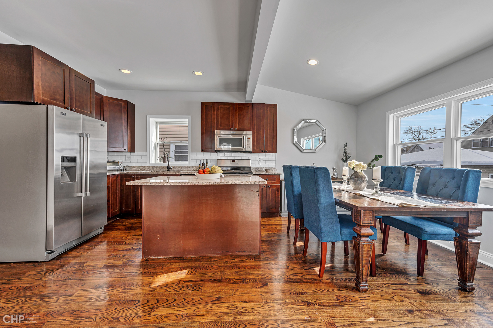 4841 West Berenice Avenue Chicago, IL 60641 - Photo 8 of 34 a living room with stainless steel appliances granite countertop furniture wooden floor and a kitchen view
