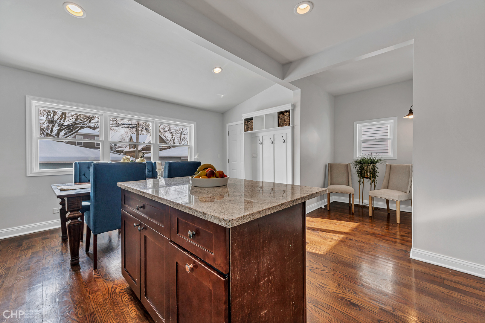 4841 West Berenice Avenue Chicago, IL 60641 - Photo 9 of 34 a kitchen with a counter top space and a dining table