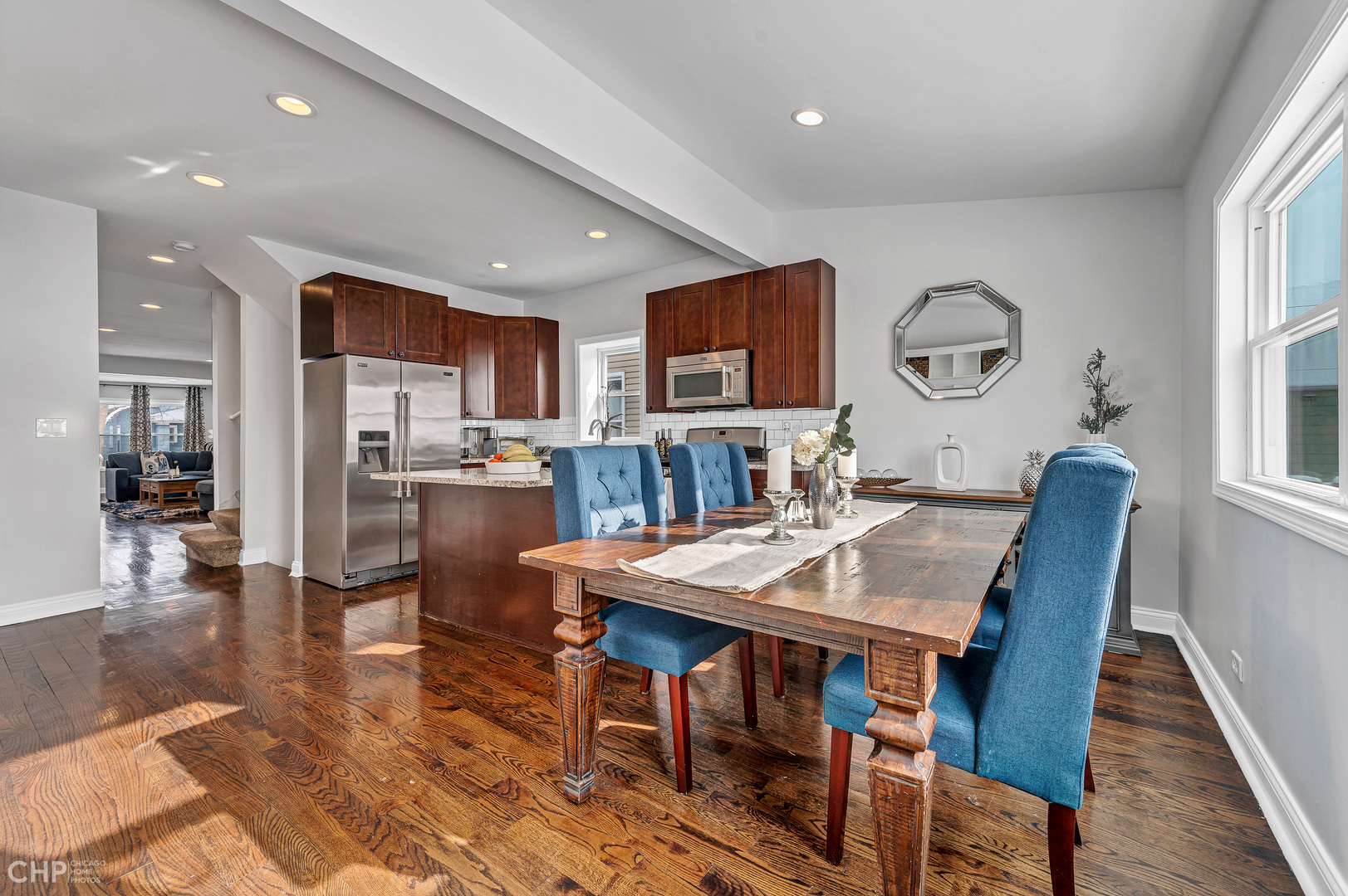 4841 West Berenice Avenue Chicago, IL 60641 - Photo 10 of 34 a view of a a dining room with furniture window and wooden floor