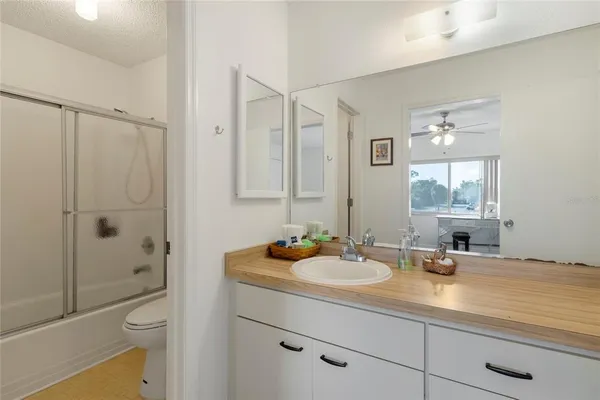a bathroom with a shower and a toilet