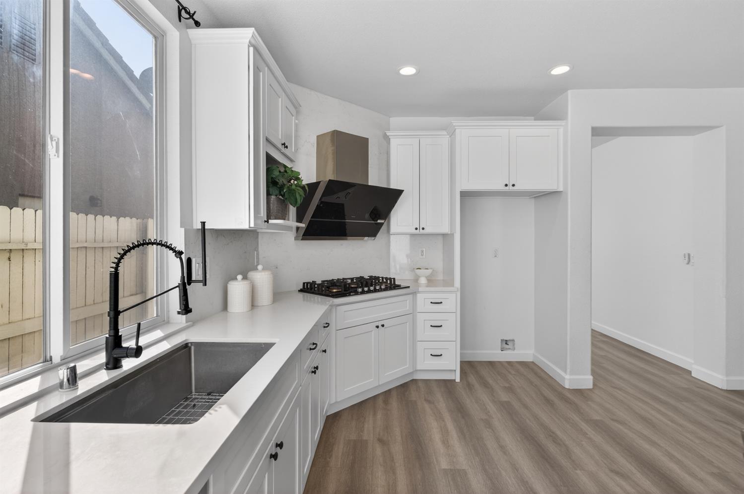 6217 Jefjen Way Elk Grove, CA 95757 - Photo 23 of 58 a kitchen with a sink stove top oven and refrigerator