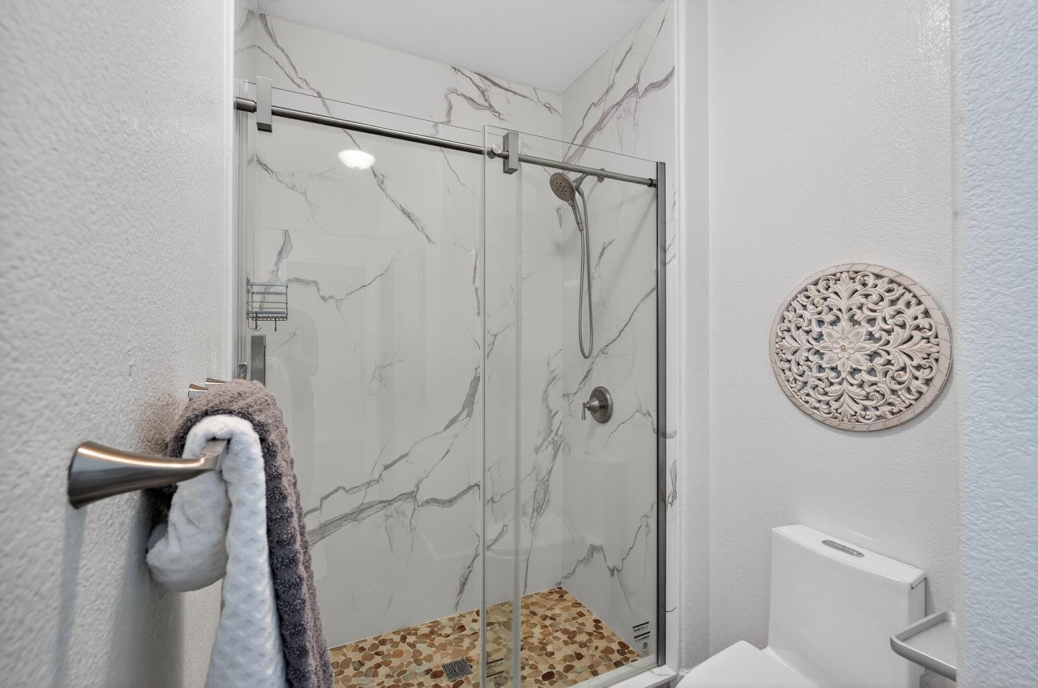 6217 Jefjen Way Elk Grove, CA 95757 - Photo 27 of 58 a bathroom with a shower and a toilet