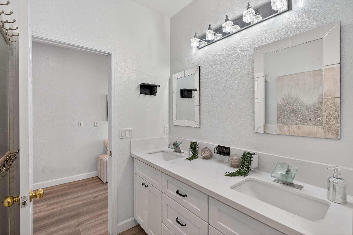 6217 Jefjen Way Elk Grove, CA 95757 - Photo 28 of 58 a bathroom with a sink and a mirror