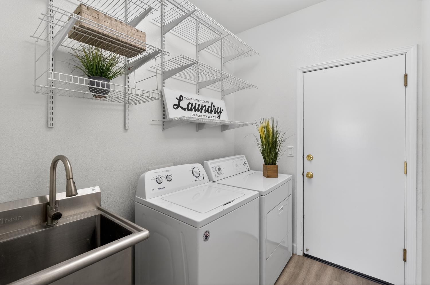 6217 Jefjen Way Elk Grove, CA 95757 - Photo 29 of 58 a view of a sink and utility room with washer and dryer