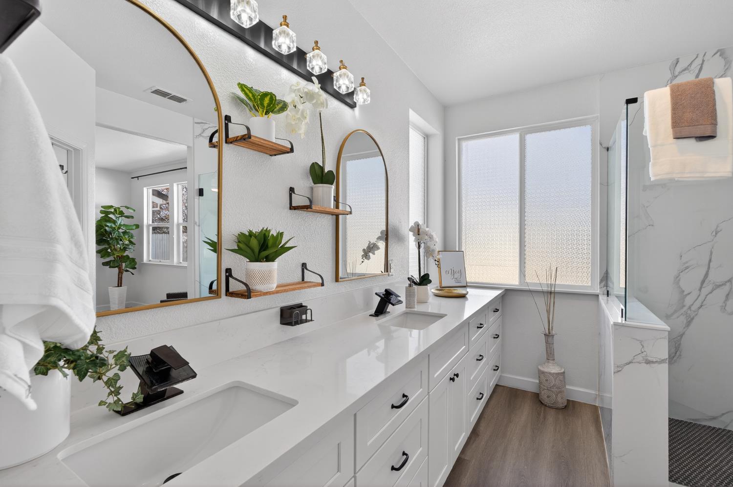 6217 Jefjen Way Elk Grove, CA 95757 - Photo 41 of 58 a bathroom with a double vanity sink and a mirror
