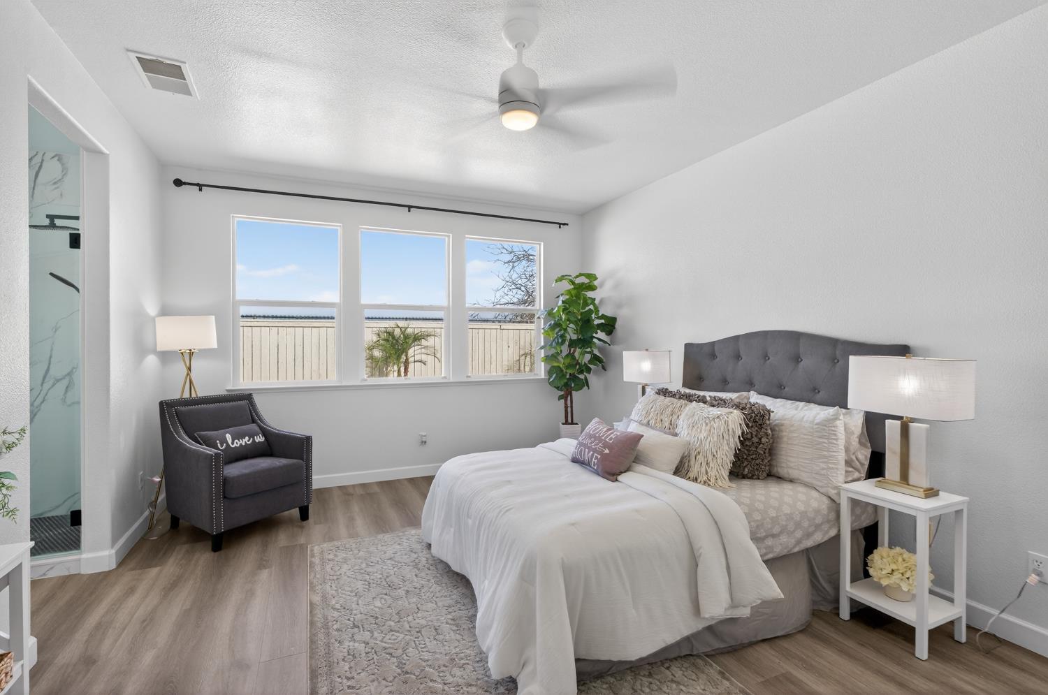 6217 Jefjen Way Elk Grove, CA 95757 - Photo 5 of 58 a bedroom with a bed and a couch