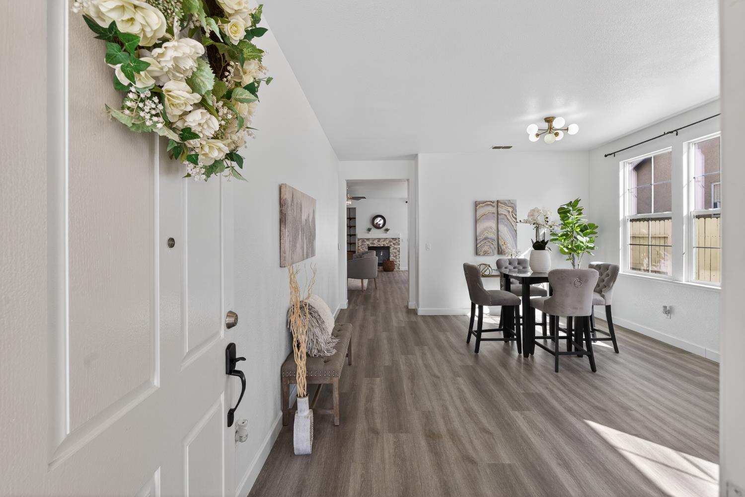 6217 Jefjen Way Elk Grove, CA 95757 - Photo 10 of 58 a view of a dining room with furniture window and wooden floor