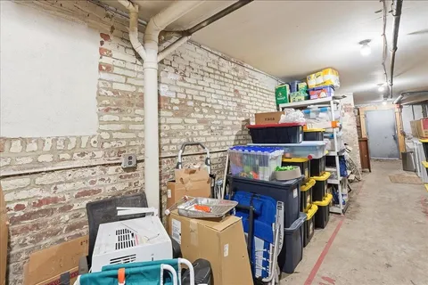 a room with water heater refrigerator washer and dryer