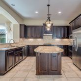a kitchen with a sink stove and refrigerator