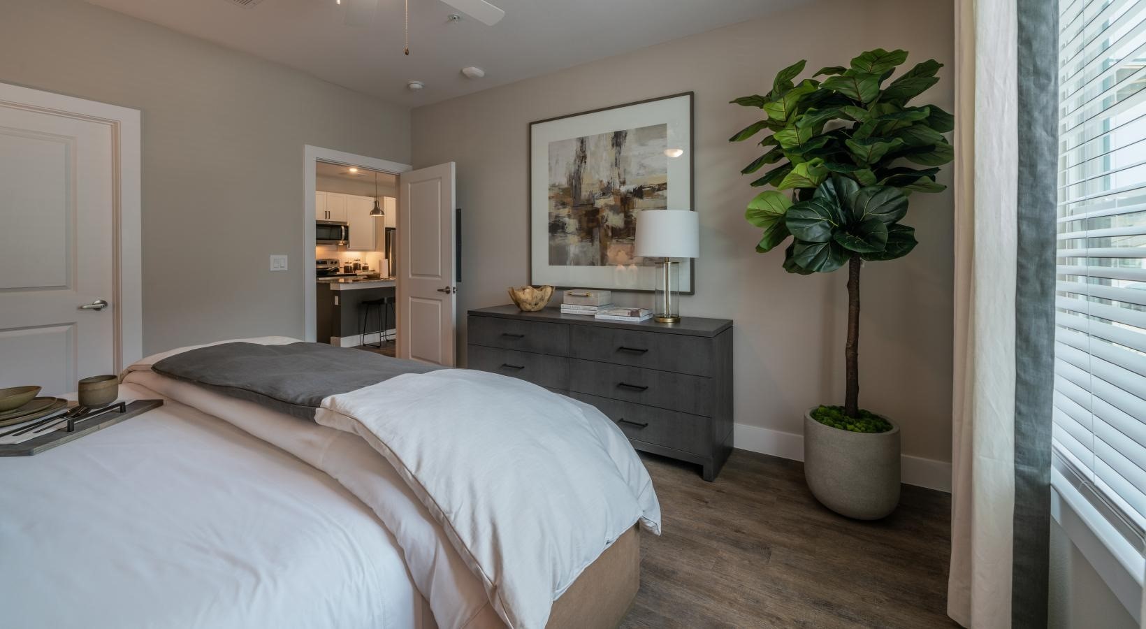 4647 Harvest Corner Drive, Unit 1114 Richmond, TX 77406 - Photo 12 of 34 a bedroom with a bed and a potted plant