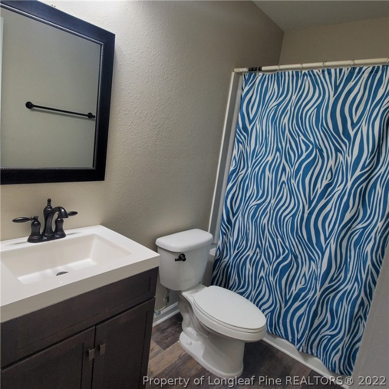 251 Botanical Court Bunnlevel, NC 28323 - Photo 5 of 16 a bathroom with a sink and a toilet