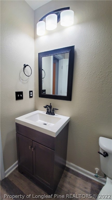251 Botanical Court Bunnlevel, NC 28323 - Photo 6 of 16 a bathroom with a toilet sink and mirror